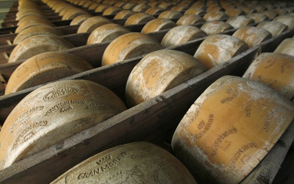 Wheels of parmesan are stored on shelves to mature at a diary plant in Litovel